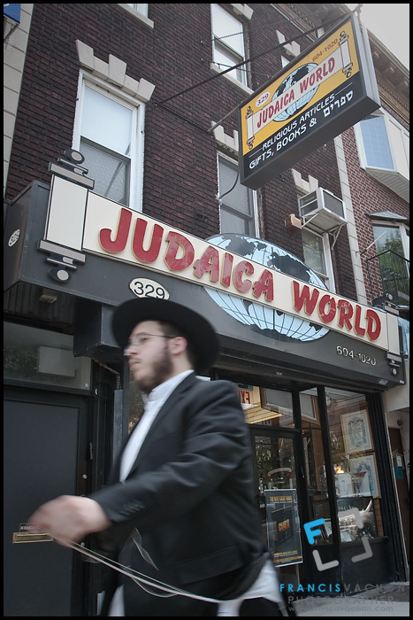 Hasidic Lubavitcher holding tallit katan