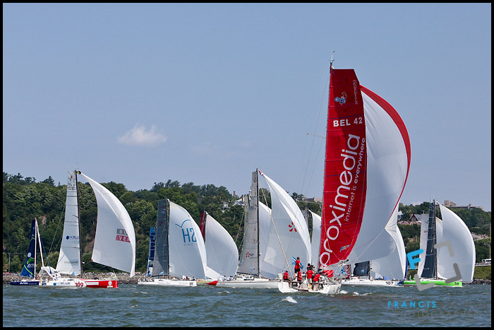 Sail boat Proximedia, with the red sail, joins a pack of boat 