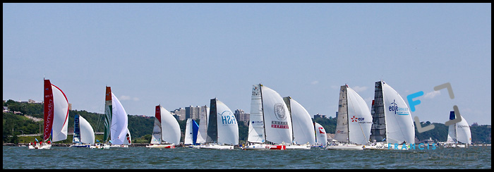 A tight pack of sail boats