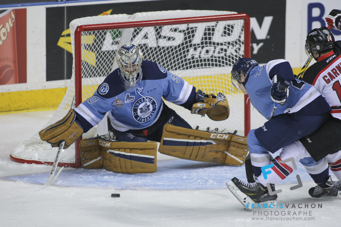 Rimouski Oceanic goal keeper Louis-Philip Guindo eyes the puck in first period action at the Memorial cup tiebreaker at Le Colisee Pepsi in Quebec city Thursday May 28, 2015.