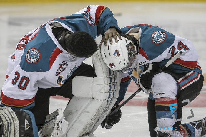 Kelowna Rockets' Michael Herringer puts his hand on his teammate Tyson Baillie after their team lost against the Oshawa Generals in the Memorial Cup final in Quebec City  on Sunday May 31, 2015. Francis Vachon/Postmedia Network