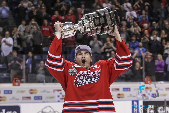 Oshawa Generals captain Josh Brown celebrates with the Memorial Cup after winning the final against the Kelowna Rockets in Quebec City on Sunday May 31, 2015. Francis Vachon/Postmedia Network
