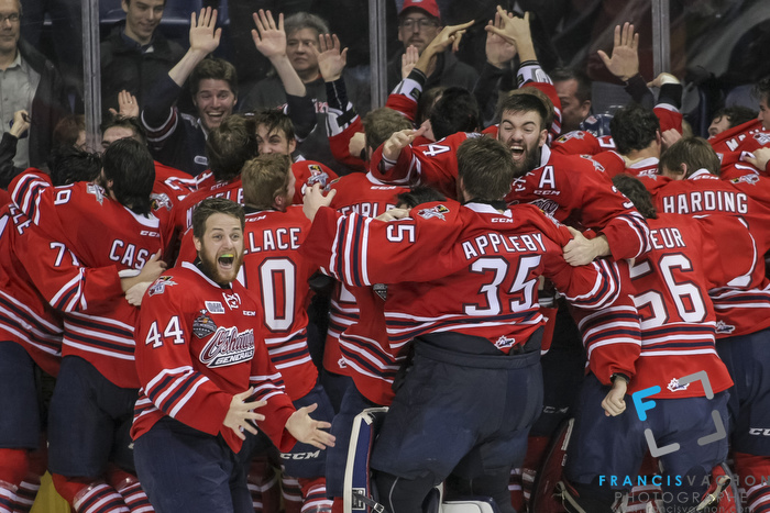 Oshawa Generals' players celebrate the overtime winning goal to win the Memorial Cup against the Kelowna Rockets in Quebec City on Sunday May 31, 2015. Francis Vachon/Postmedia Network