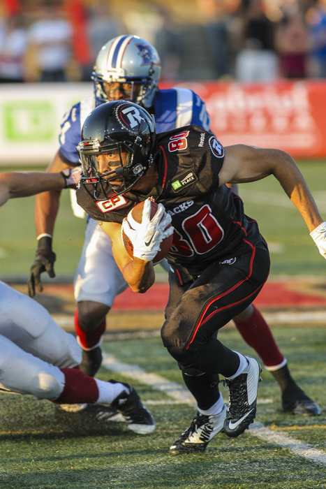 Ottawa Redblacks' Chris Williams runs with the ball during CFL action in Quebec City on Saturday June 13, 2015. Francis Vachon/Postmedia Network