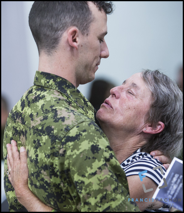 Corporal Chevalier hugs his mother Helene as they are gathered at CFB Valcartier, north of Quebec City, before leaving for Poland on Sunday June 28, 2015. An initial group of Canadian Armed Forces members from Valcartier are leaving for Poland this Sunday to take part in the 4th rotation of Operation REASSURANCE. 