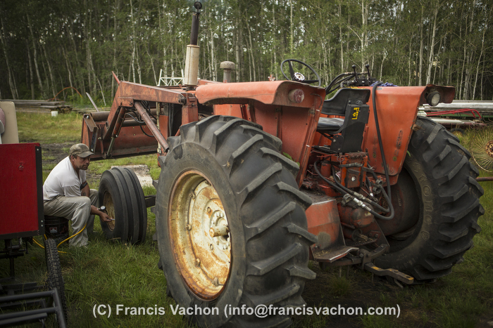 Yves Breton tends on his 1967 Cockshutt 1650 tractor in Saint-Laurent, Manitoba, Wednesday August 12, 2015. 