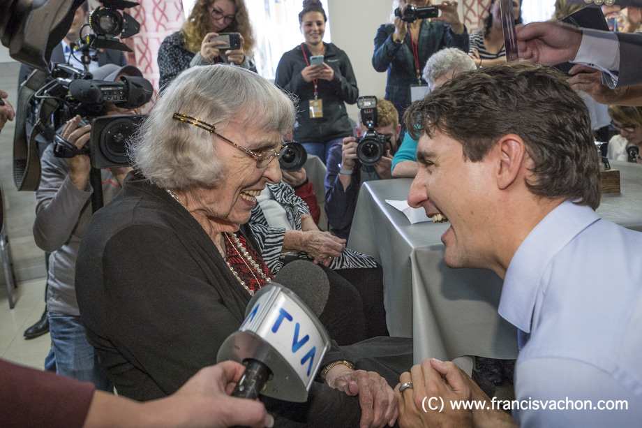 Marie-Paule Savard, 101, shakes hands with Prime Minister Justin Trudeau at a seniors' home in Roberval, Qc, on Thursday October 19, 2017. THE CANADIAN PRESS/Francis Vachon.