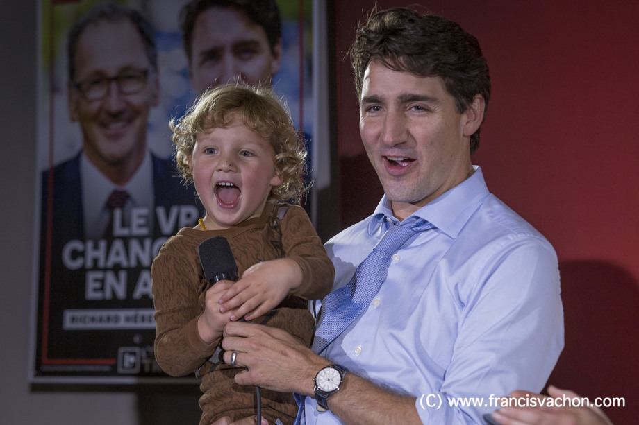 Justin Trudeau and his son Hadrien, 3, are seen during a liberal rally in Dolbeau-Mistassini, Qc, on Thursday October 19, 2017. THE CANADIAN PRESS/Francis Vachon.