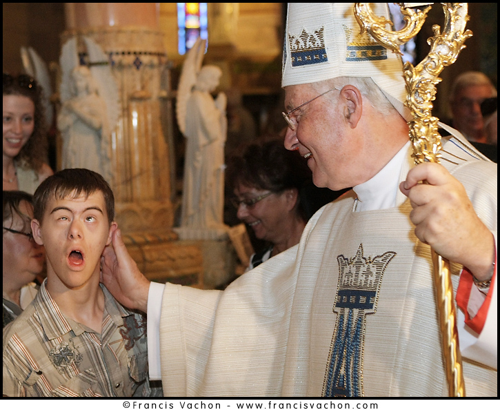 Cardinal Marc Ouellet bless a handicapped kid