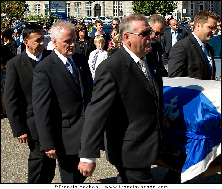 The family of Claude Bechard is seen between the bearers of his coffin as it arrives at the Sainte-Anne Cathedral in La Pocatiere Saturday September 11, 2010. Bechard passed away at 41 of a cancer