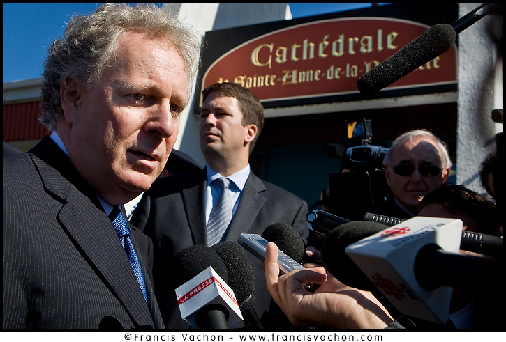 Quebec Premier Jean Charest speaks to the media as he arrives at the funeral of Claude Bechard at the Sainte-Anne Cathedral in La Pocatiere Saturday September 11, 2010. Bechard passed away at 41 of a cancer