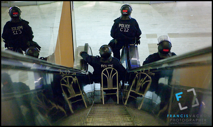 Anti-Riot police guard the escalator leading to the Hilton hotel in Quebec City after a clash with student trying to get to the hotel's ballroom Monday December 6, 2010.  A forum on increasing tuition fees was held inside the hotel, just across the National Assembly